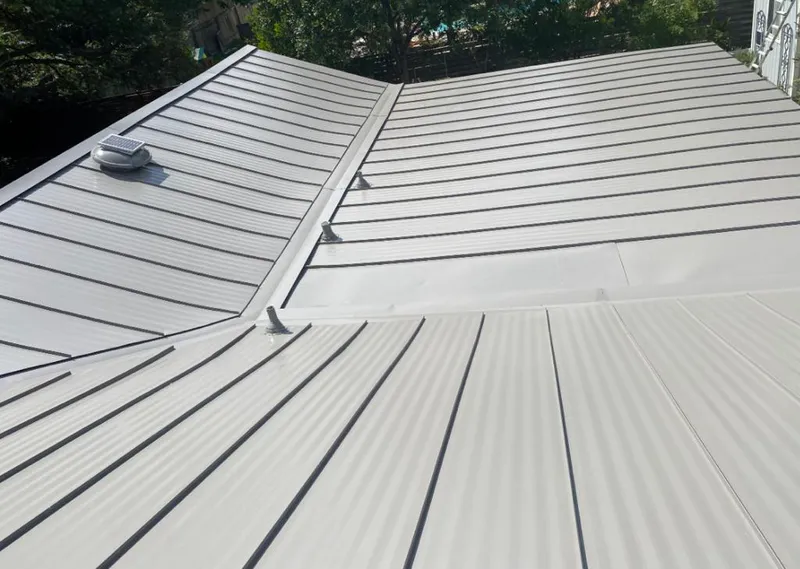 Solar attic fan installed on a metal roof for Roof Ventilation in Treasure Island
